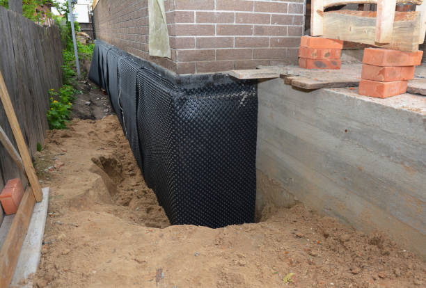 SJ Waterproofing Pros technician performing targeted Emergency Waterproofing assessment in Towson, MD